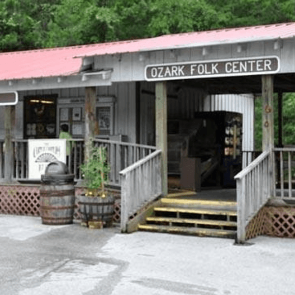 Front entrance of the Ozark Folk Center with a wooden ramp and signage.